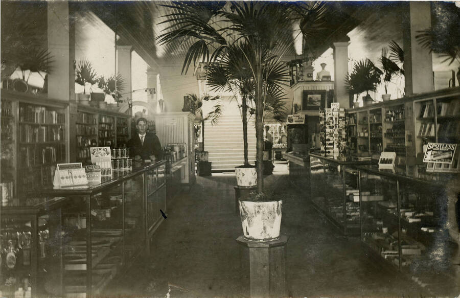 Postcard of the interior of the drug store in Potlatch.