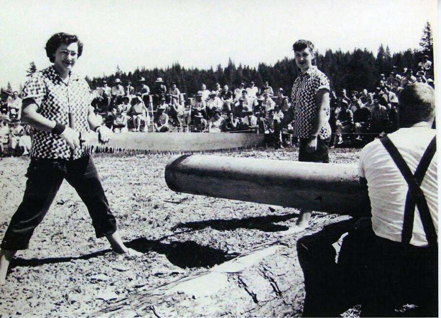 Photograph of the women's crosscut competition at Potlatch Days.