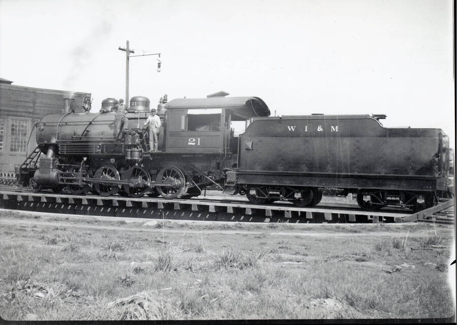 Photograph of WI&M Railway Locomotive #21 with Elmer Helm and Alfred Howard.