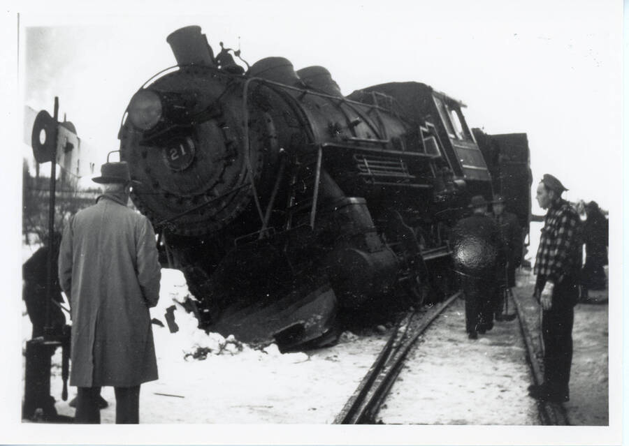 Photograph of Locomotive #21 on the ground in Potlatch when it hit a patch of ice on the rails.
