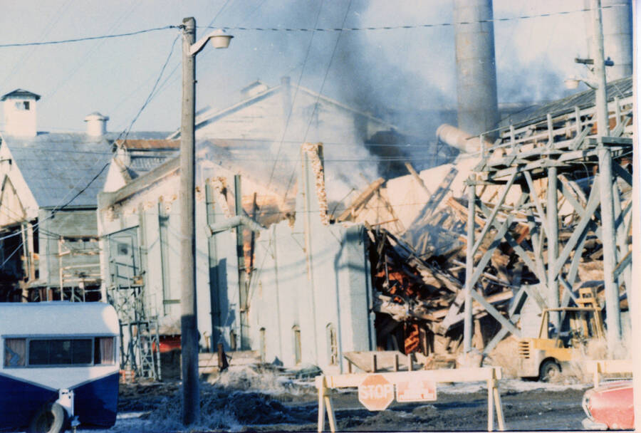 Photograph of demolition and burning of buildings at the Potlatch Mill.