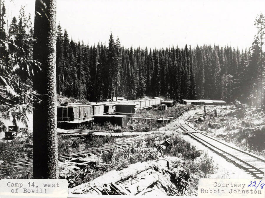 View of Camp 14, located west of Bovill. A railroad can be seen running next to the buildings on the camp.