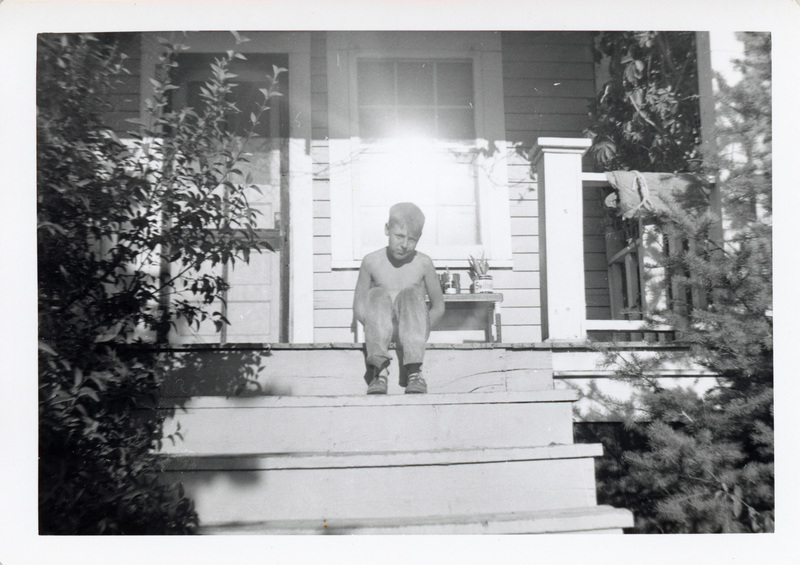 Photograph of Dale Dixon sitting on the steps.