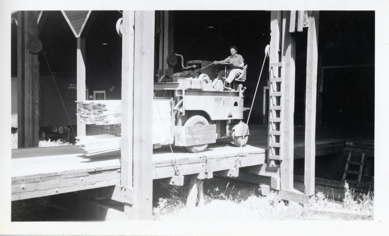 Photograph of a lift truck loaded with lumber in the Potlatch Mill.