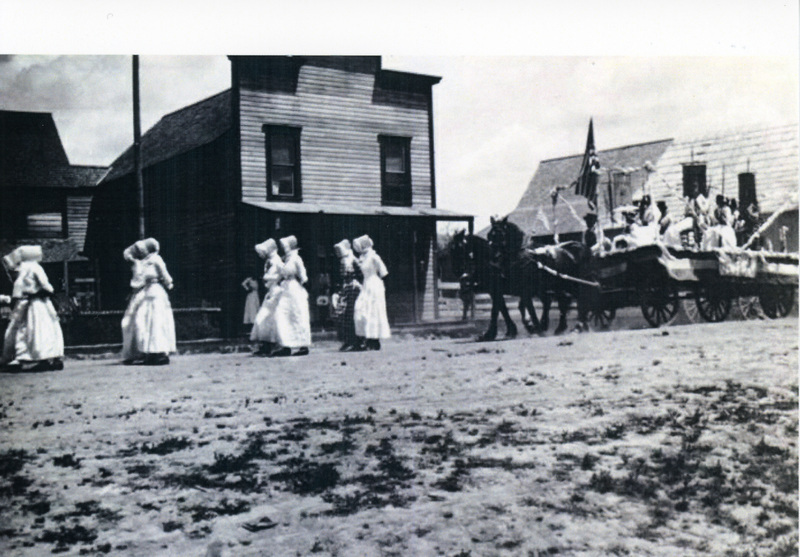 Photograph of women marching in the Fourth of July parade in Princeton.