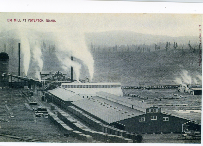 Photograph of the Potlatch Mill with the green chain in the foreground.