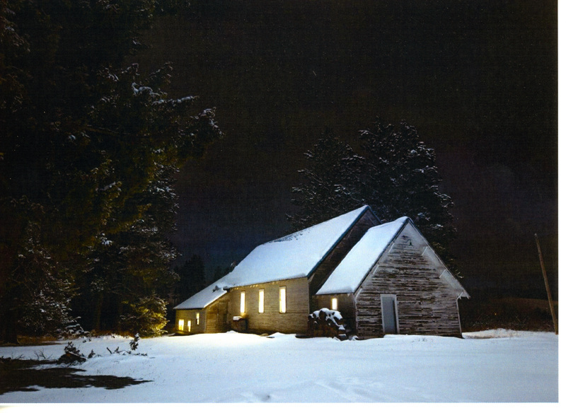 Photograph of Mountain Home Grange at nigh in winter.