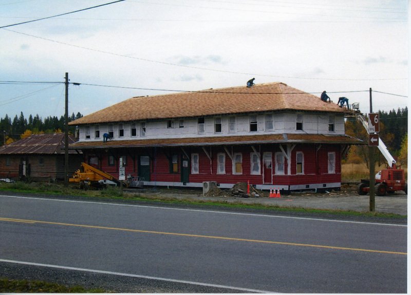 Photograph of men completing the roof and painting the WI&M Depot.