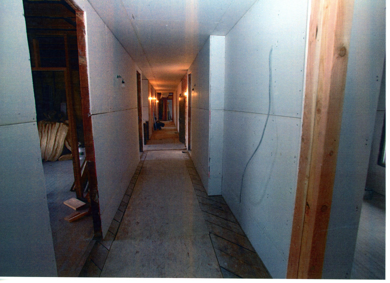 Photograph of sheetrock installed in the hallway of the 2nd floor of the WI&M Depot.