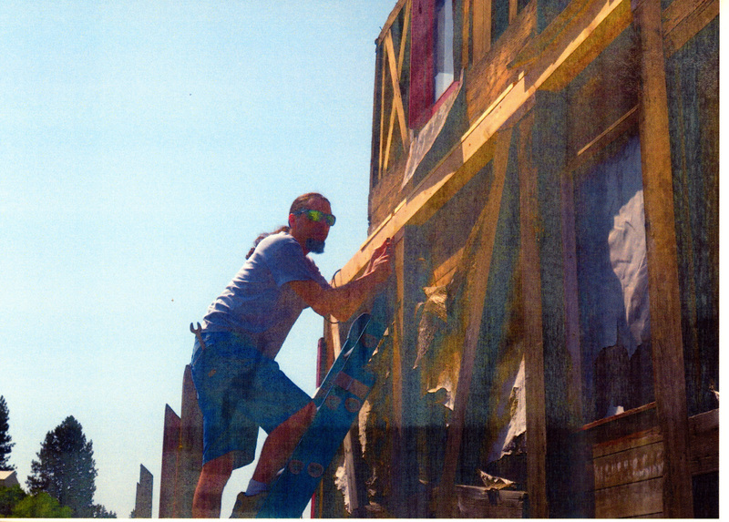 Photograph of a man beginning the restoration of the Caboose X-5.