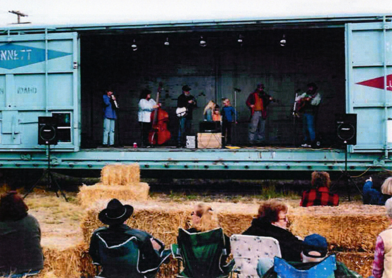 Photograph of band performing on the BENX 182 stage at the WI&M Depot.