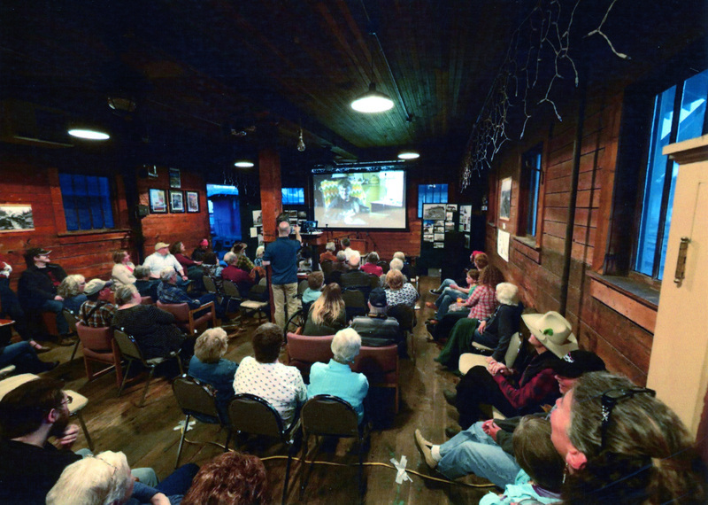Photograph of the audience for a program in the freight room of the WI&M Depot.