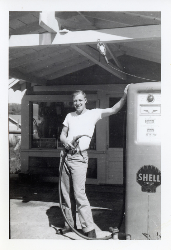 Photograph of Bill Petrie at a service station.