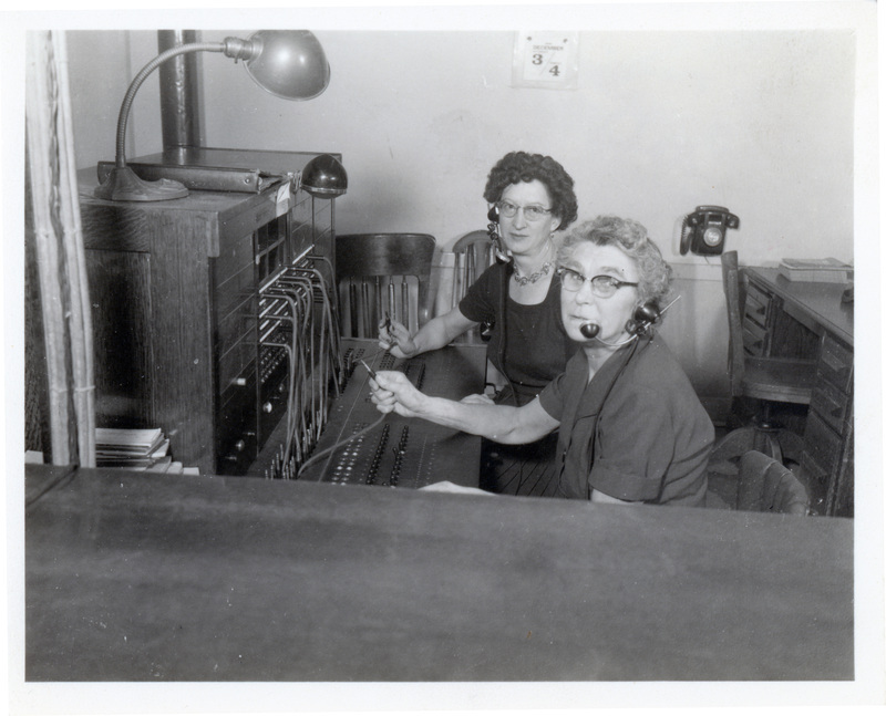 Photograph of Mary May and Mavis Browning at the telephone switboard in Potlatch.