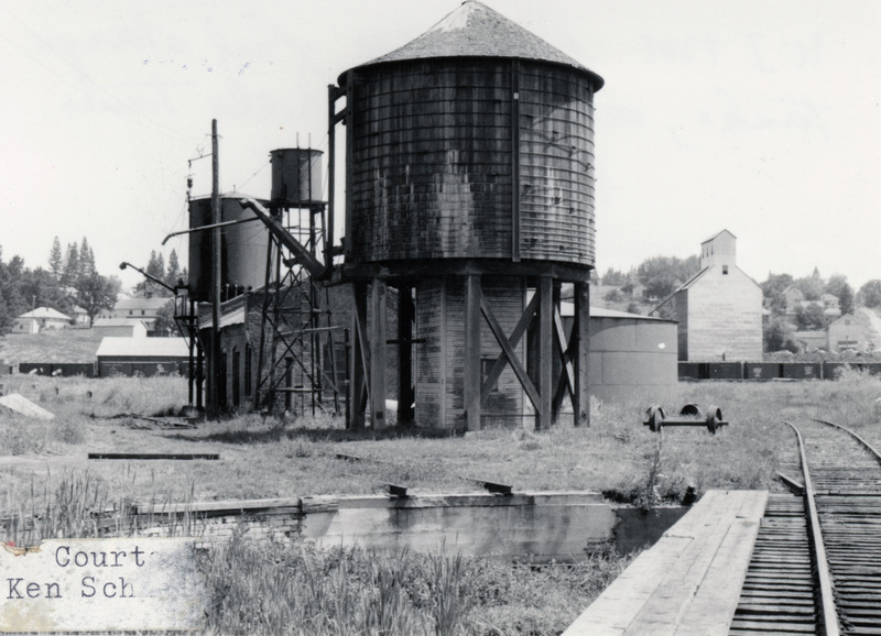 Photograph of the fuel tank, oil house, and water tank at the Potlatch Mill.