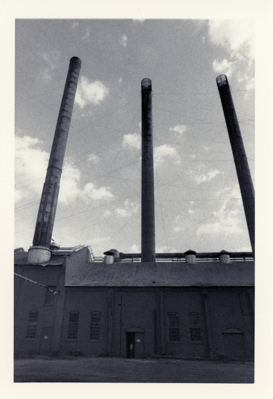 Photograph of smoke stacks above the power house at the Potlatch Mill.