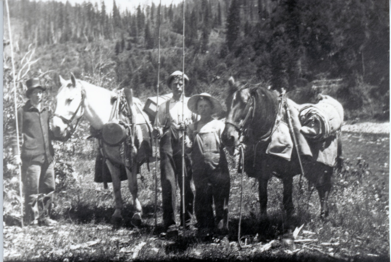 Photograph of the Thrasher family with their horses.