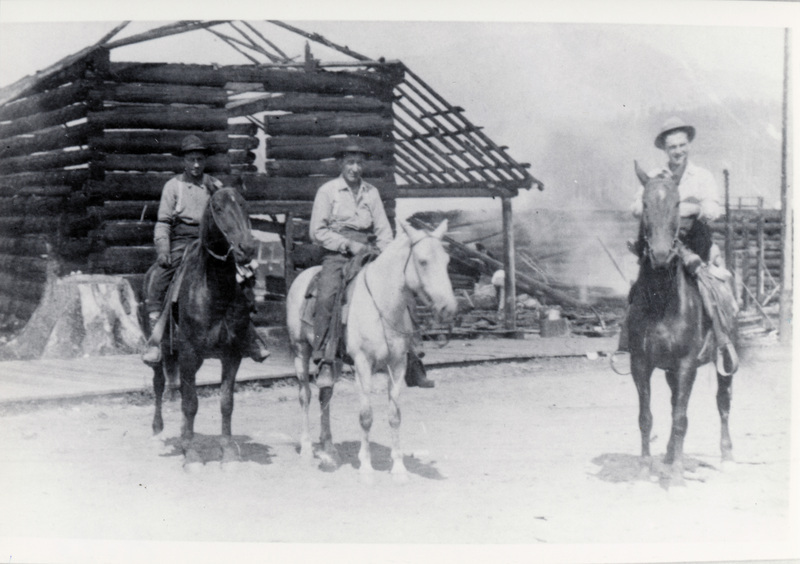 Photograph of Frank Mallory on horeback with other men.