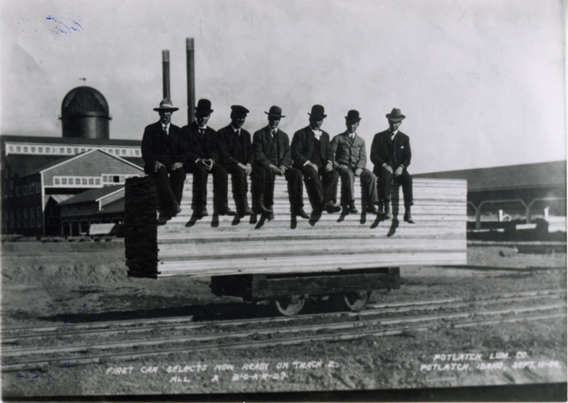 Photograph of the first load of lumber at the Potlatch Mill with Mark Seymour,Sr.; A.H. Irving;W.A. Wilkinson; A.W. Laird; Bill Deary; Cliff Muser;and R.M. Weyerhaeuser