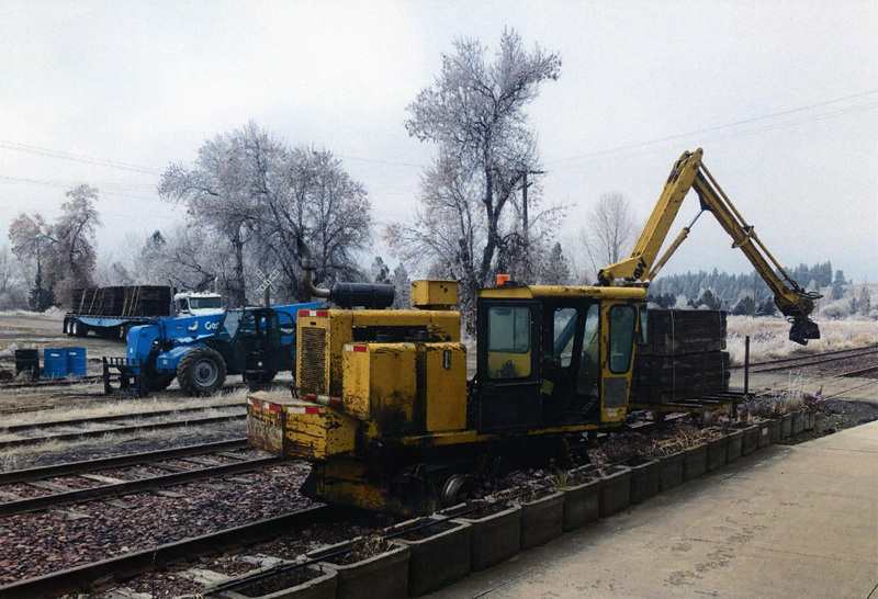 Photograph of machines replacing the ties on the track of the WI&M Railway.