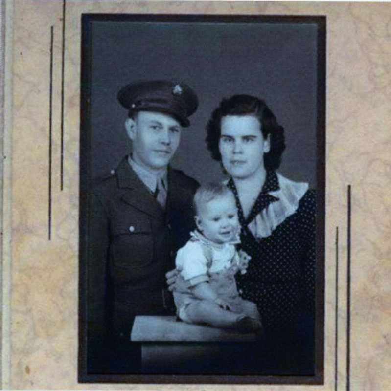 Photograph of Leonard and Elizabeth (Strong) Doty holding Arnold.