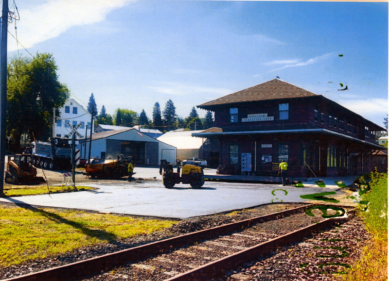 Photograph of paving the parking lot at the WI&M Depot.