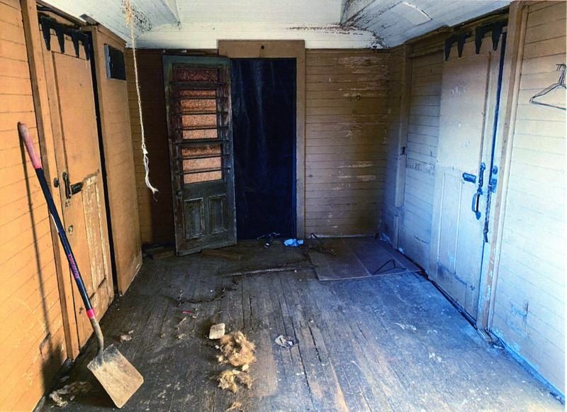 Photograph of the interior of passenger car 306 prior to restoration.