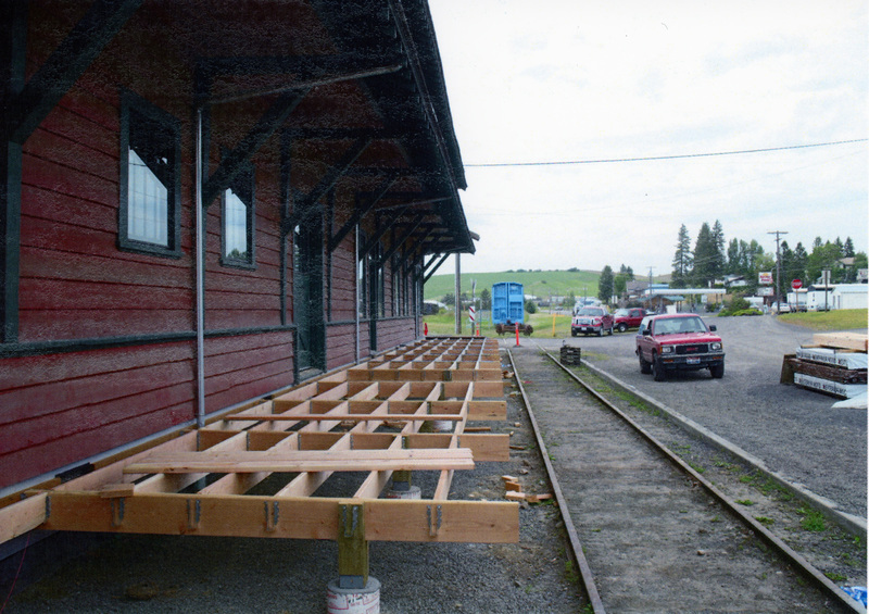 Photograph of men framing the platform on the East side of the WI&M Depot.
