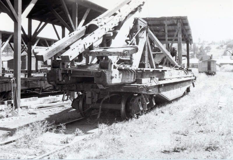 Photograph of a pile driver on a PFI heavy duty flat car in the Potlatch yards.