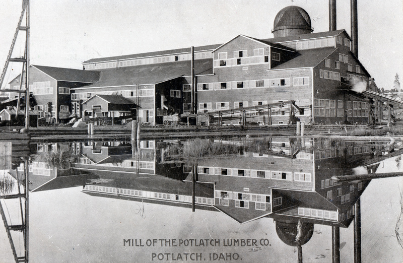 Postcard of the Potlatch mill with its reflection in the water.
