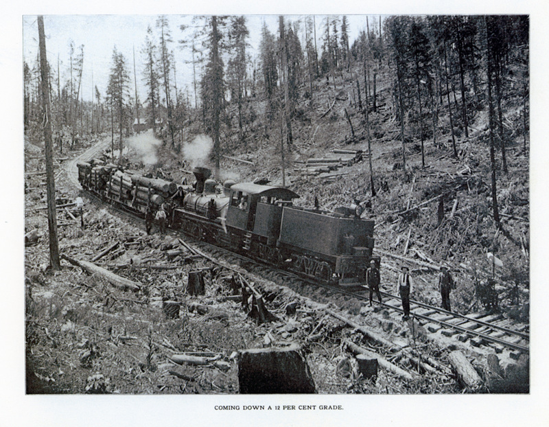 Photograph of men and train coming down a 12 percent grade.