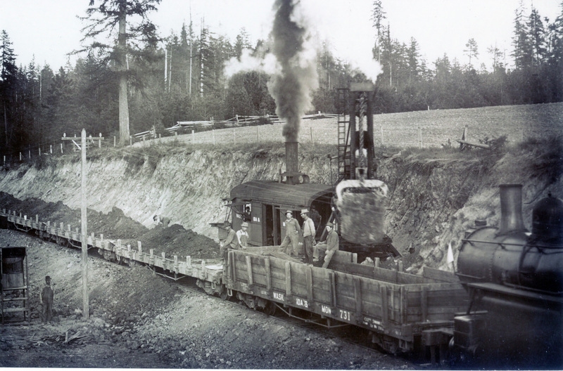 Photograph of a work train (#2) with a WI&M steam shovel near Bovill, 1909-1912.