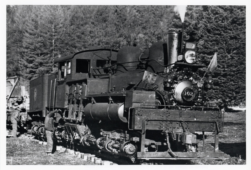 Photograph of Shay #102 with Engineer Ed "Cannonball" Baker.