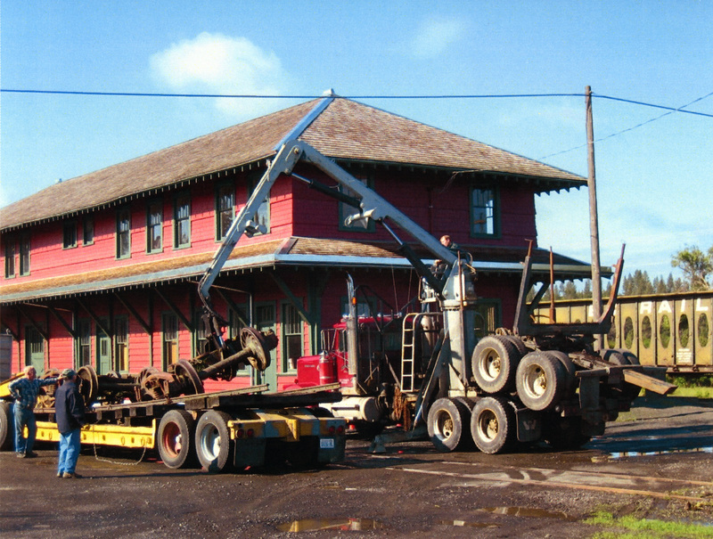 Photograph of unloading freight trucks at the WI&M Depot for the Caboose X-5.