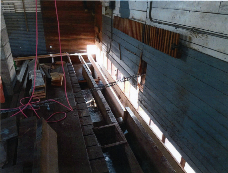Photograph of the north wall and floor in the WI&M Depot Annex during restoration.