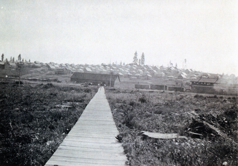 Photograph of the wood sidewalk from the Potlatch Mill to the town.
