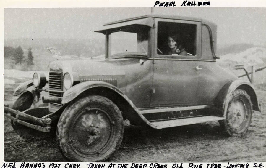 Pearl Kellmer driving Ned Hanna's 1927 Chev. Photograph is looking Southeast from the Deep Creek Old Pine Tree.