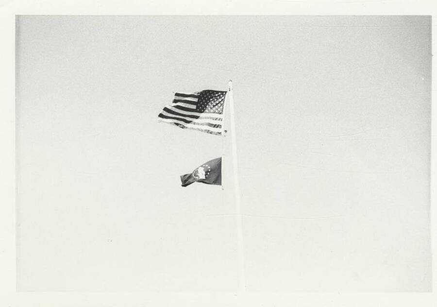 A photograph of the American Flag with another flag below it.