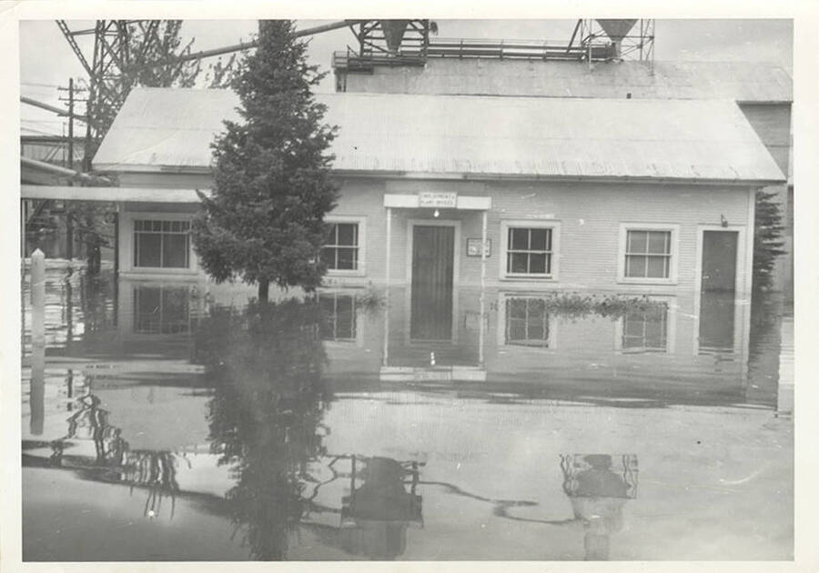 A photograph of the outside of a building during a flood.
