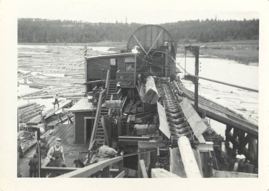 A photograph of the log slip used to transport logs from the pond to the mill.