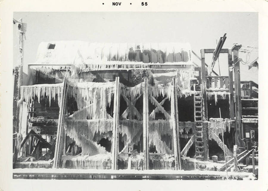 A photograph of a building covered in icicles just in November.