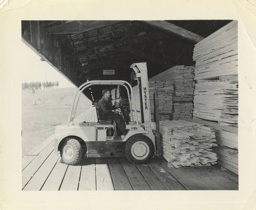 The 'Hyster' placing the lumber in a covered area