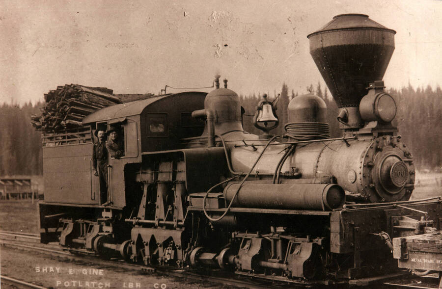 A photograph of the Shay engine at the Potlatch Lumber Company hauling lumber.