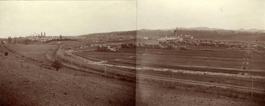 A view of Potlatch, the lumber yard, and train tracks.