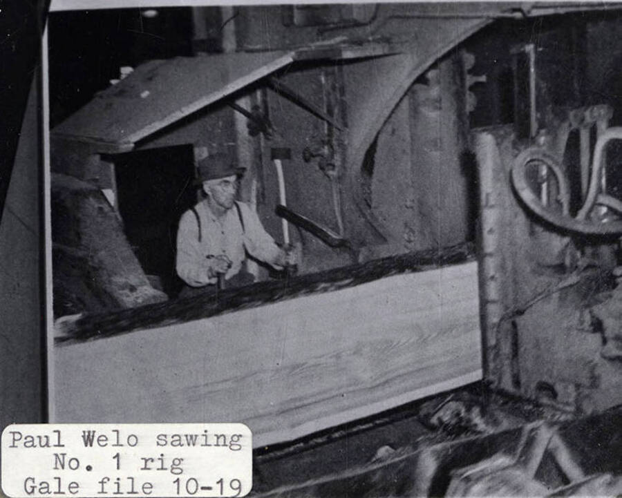A photograph of Paul Welo sawing on rig No. 1 from the 10-19 Gale file.