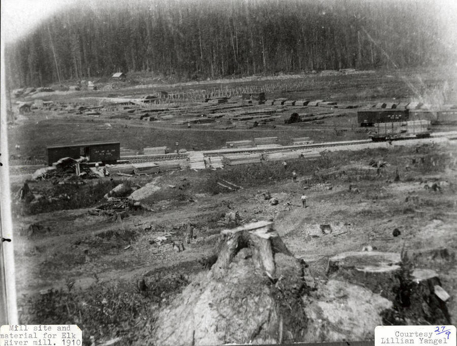 A photograph of a mill site and material for the Elk River Mill.