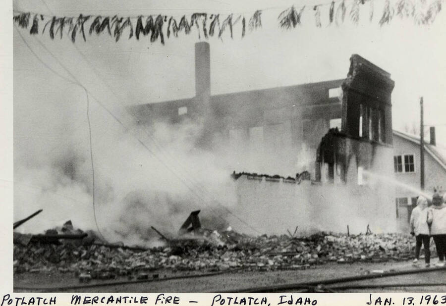 A photograph of the Potlatch Mercantile Fire being put out in Potlatch, Idaho.