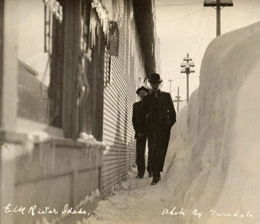 A photograph of two men and a lot of snow in Elk River, Idaho.