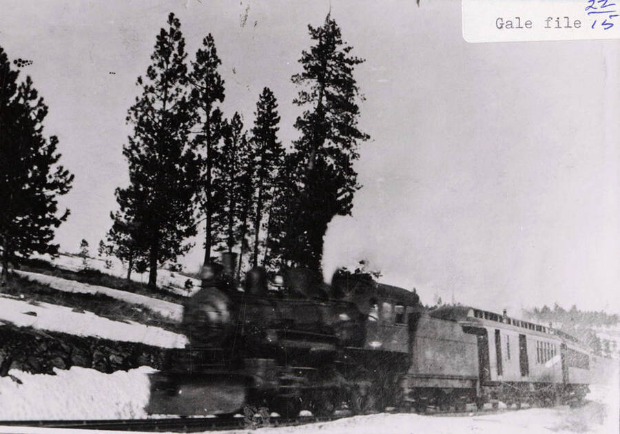 Early view of the WI&M passenger train surrounded by snow. The train can be seen on the railroad tracks.
