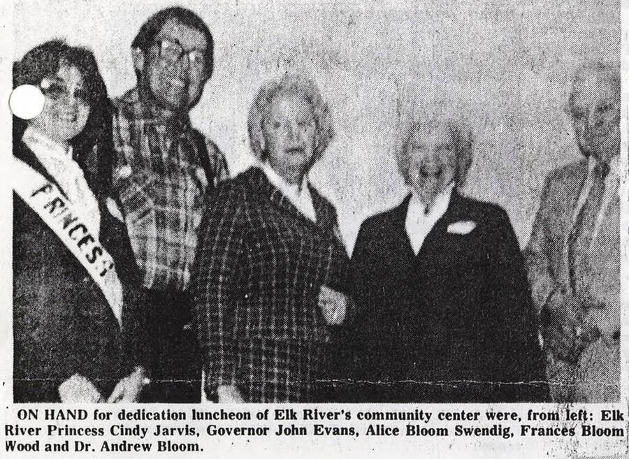 A photograph of Elk River Princess Cindy Jarvis, Governor John Evans, Alice Bloom Swendig, Frances Bloom Wood, and Dr. Andrew Bloom at the dedication luncheon of Elk River's community center.